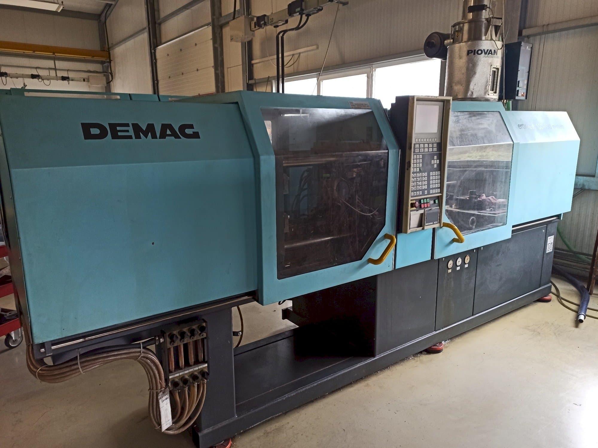 Left side view of DEMAG Ergotech 150-610 Compact  machine