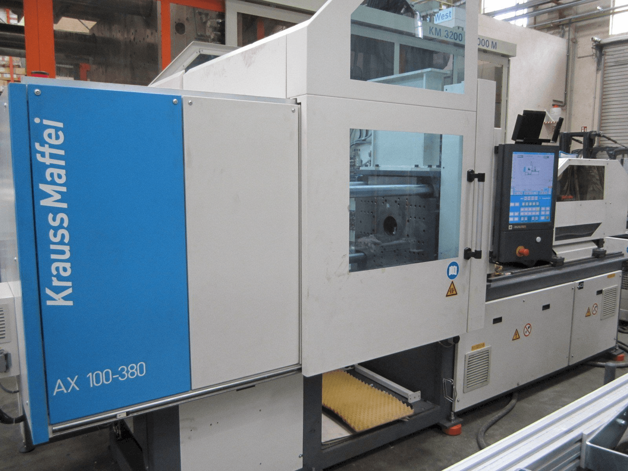 Front view of Krauss Maffei 100-380 AX machine